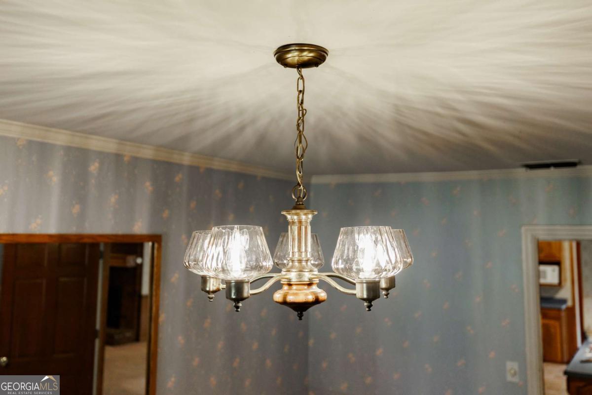 389 Ashton Drive Athens, GA 30606 - Photo 17 of 72 a room with a chandelier