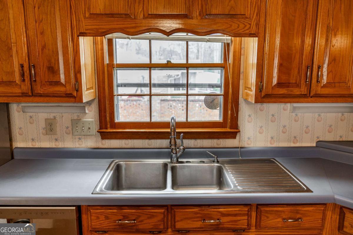 389 Ashton Drive Athens, GA 30606 - Photo 28 of 72 a kitchen with a sink and cabinets