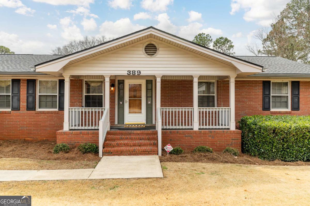 389 Ashton Drive Athens, GA 30606 - Photo 3 of 72 a front view of a house with a yard