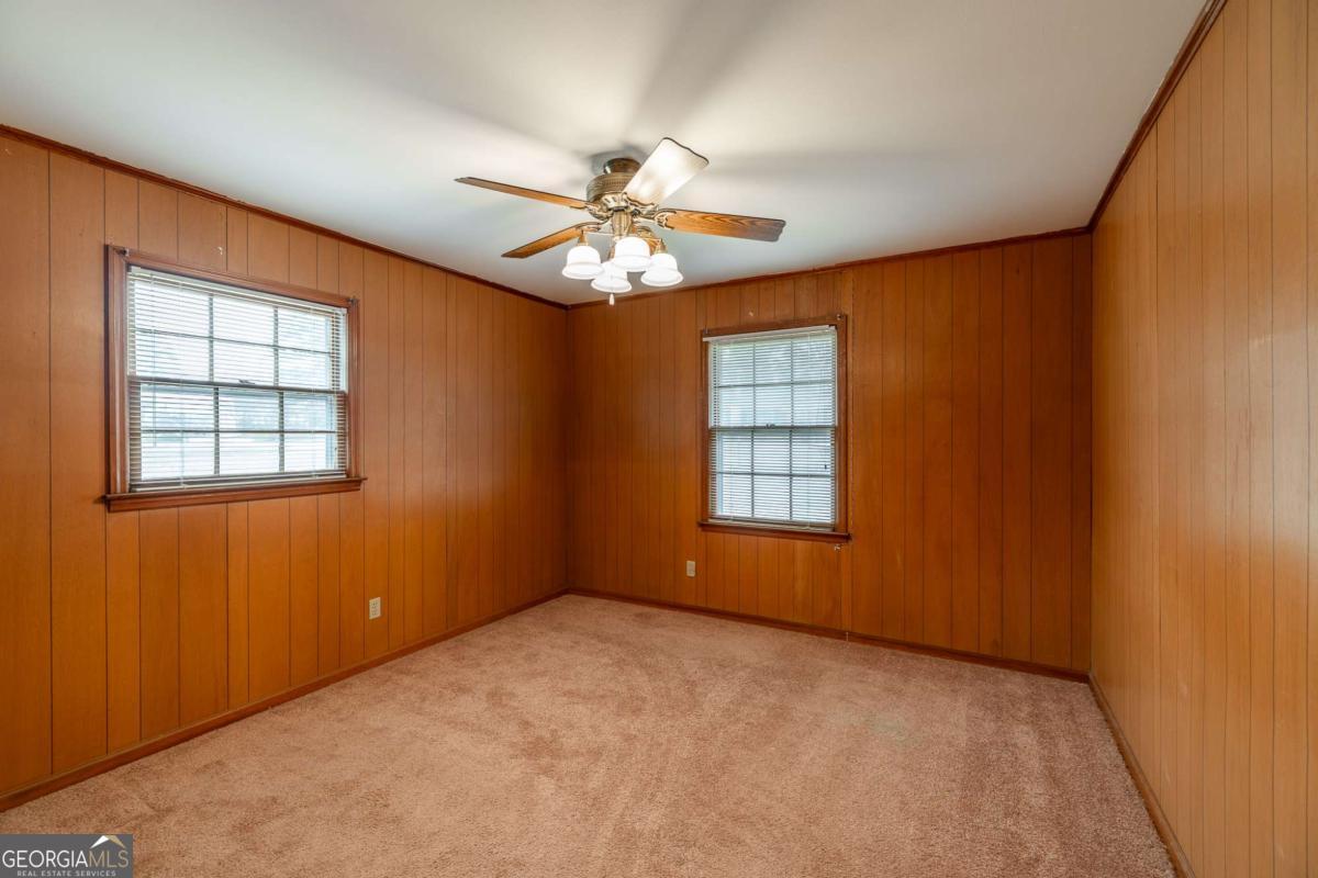 389 Ashton Drive Athens, GA 30606 - Photo 38 of 72 an empty room with windows and fan