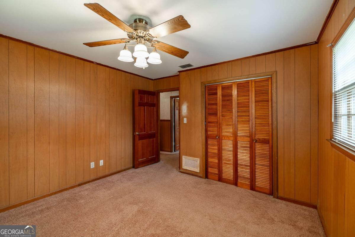 389 Ashton Drive Athens, GA 30606 - Photo 39 of 72 wooden floor in an empty room and a window