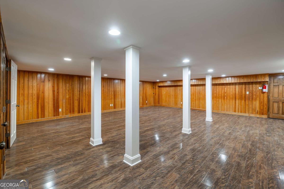 389 Ashton Drive Athens, GA 30606 - Photo 53 of 72 a view of an empty room with wooden floor