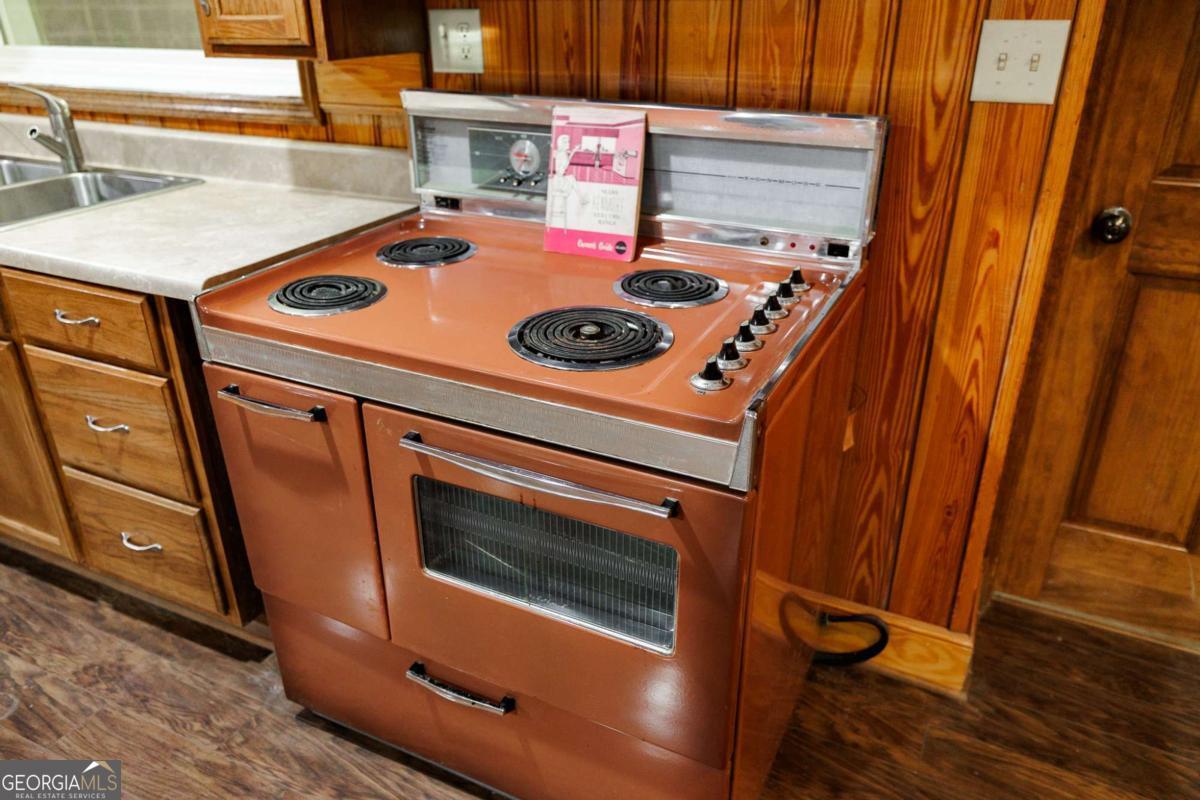 389 Ashton Drive Athens, GA 30606 - Photo 56 of 72 a stove top oven sitting inside of a kitchen