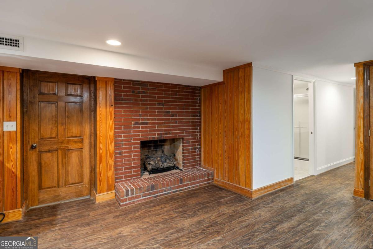 389 Ashton Drive Athens, GA 30606 - Photo 58 of 72 a view of a livingroom with wooden floor and a fireplace