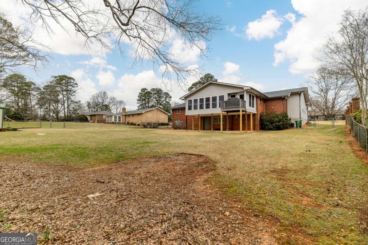 389 Ashton Drive Athens, GA 30606 - Photo 68 of 72 a front view of a house with a yard
