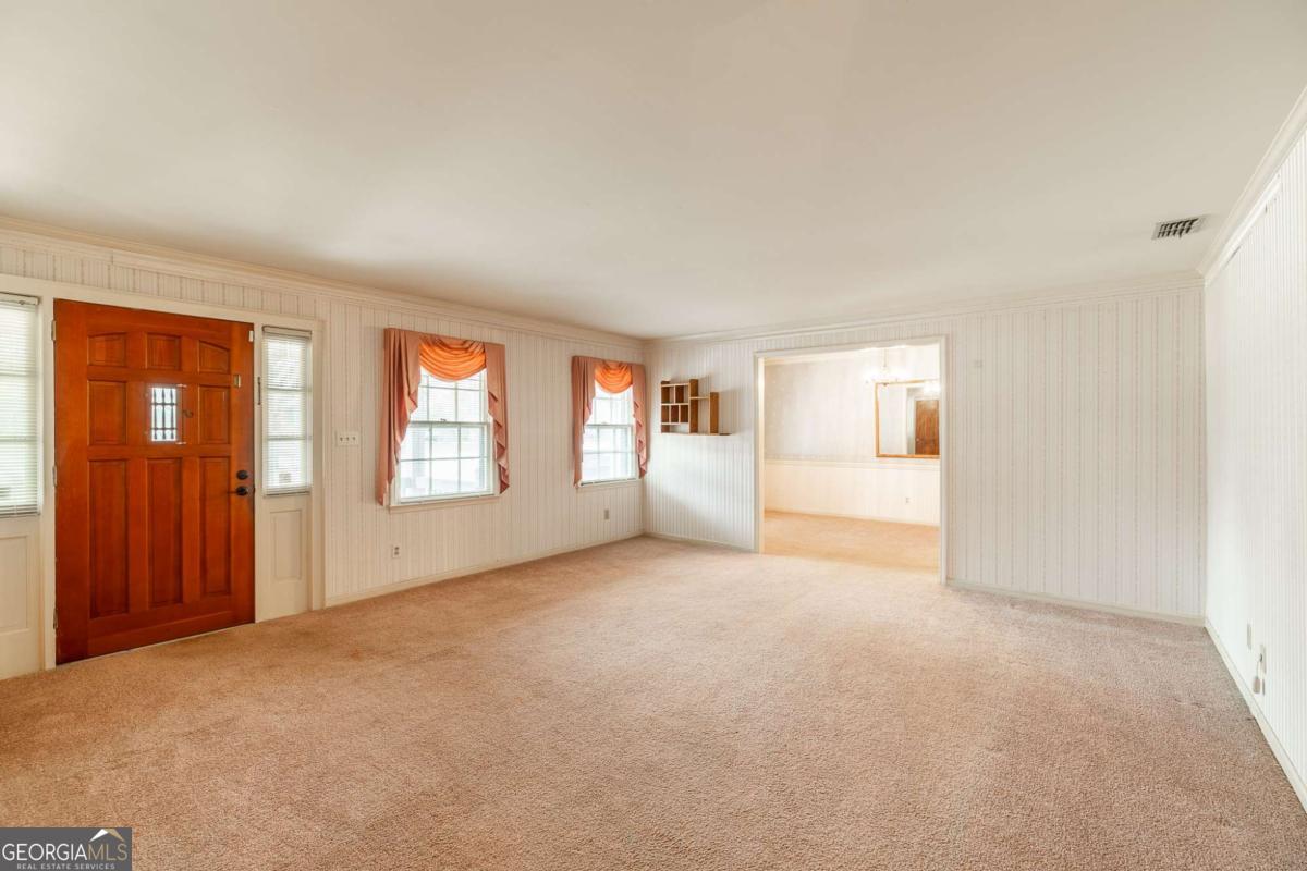 389 Ashton Drive Athens, GA 30606 - Photo 10 of 72 a view of an empty room with a window