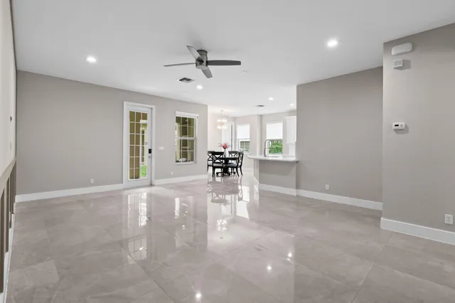 a bathroom with a tub a sink and a window