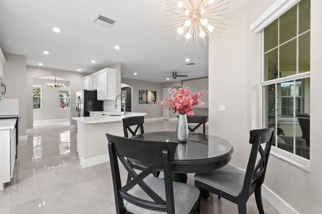 an aerial view of lake residential houses with outdoor space and swimming pool