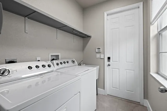 a view of a livingroom with workspace and a couch