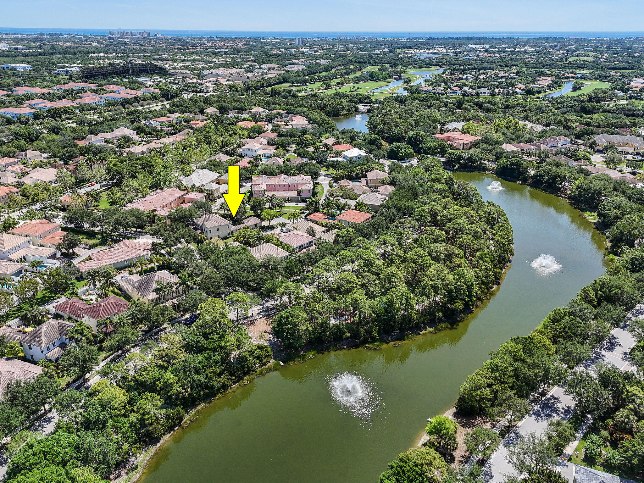 111 Tullamore Avenue Jupiter, FL 33458 - Photo 58 of 64 an aerial view of lake residential houses with outdoor space and swimming pool