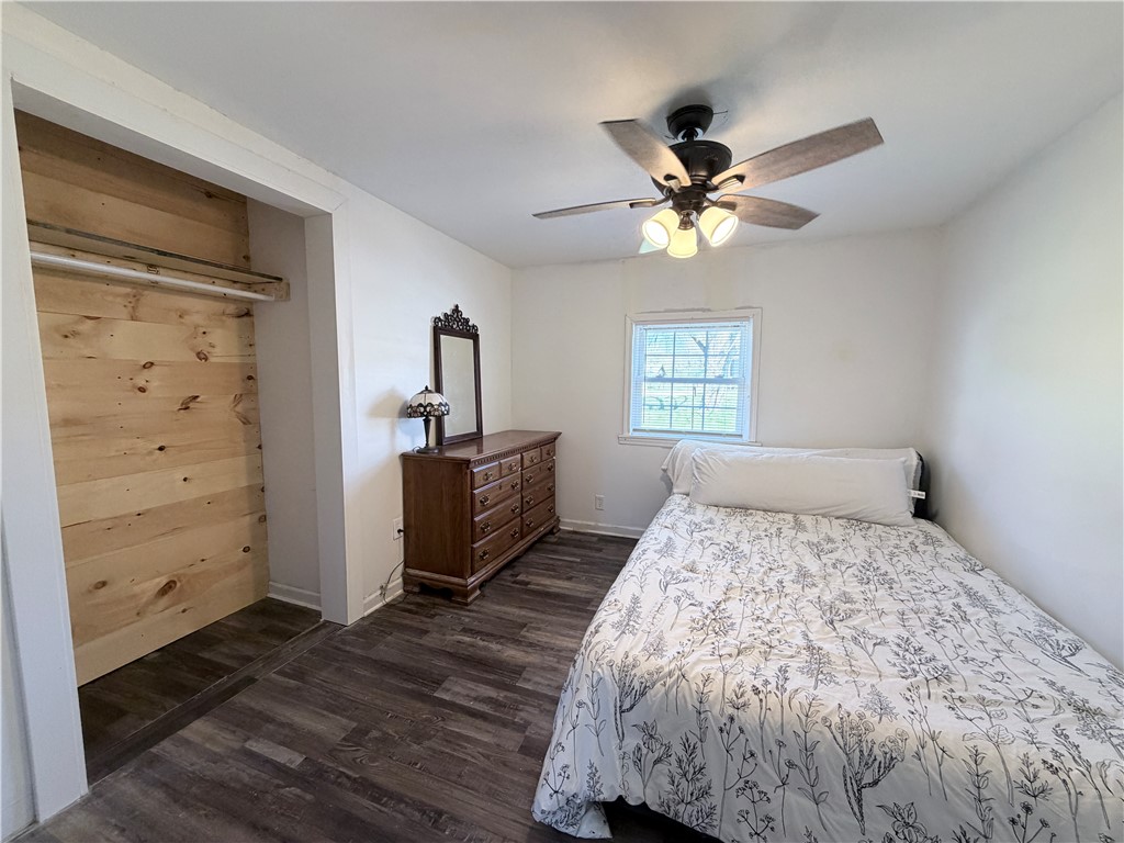 6800 Farmington Road Miamisburg, OH 45342 - Photo 14 of 32 This cozy bedroom features durable flooring and a bright window, offering comfortable living.