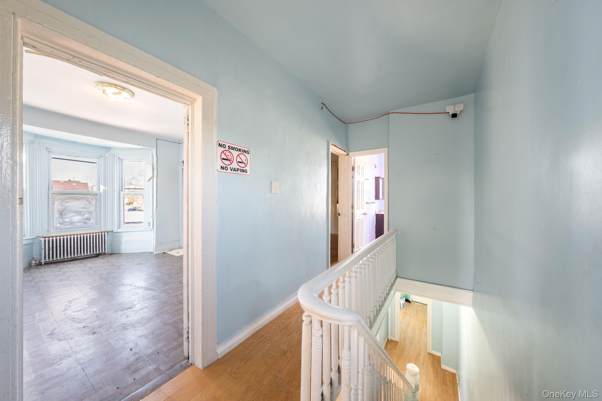 2214 Hermany Avenue Bronx, NY 10473 - Photo 15 of 43 a view of a hallway with wooden floor and entryway