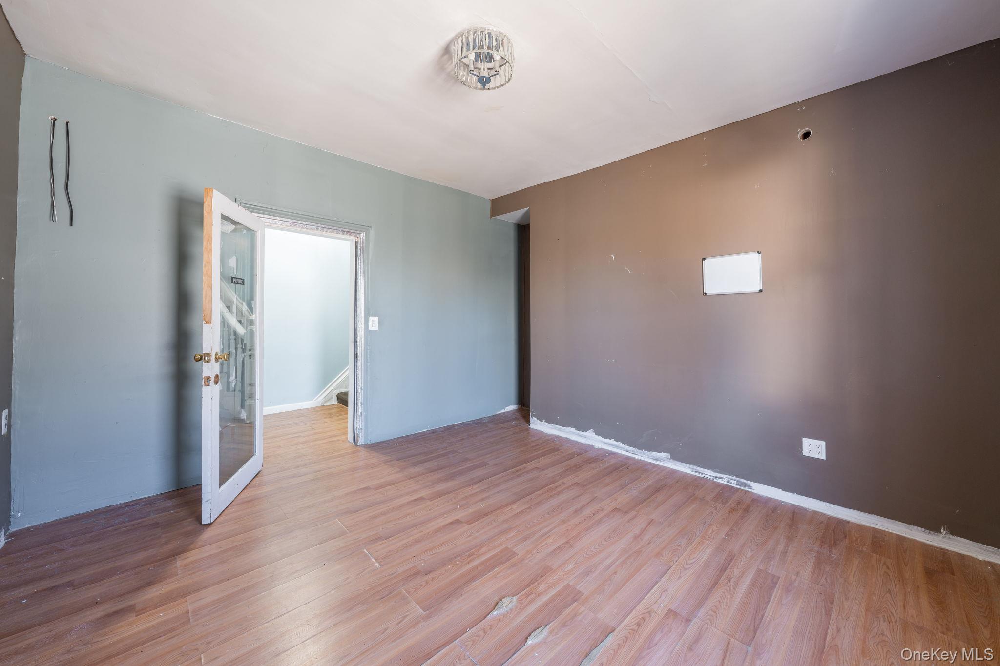 2214 Hermany Avenue Bronx, NY 10473 - Photo 20 of 43 a view of an empty room with wooden floor