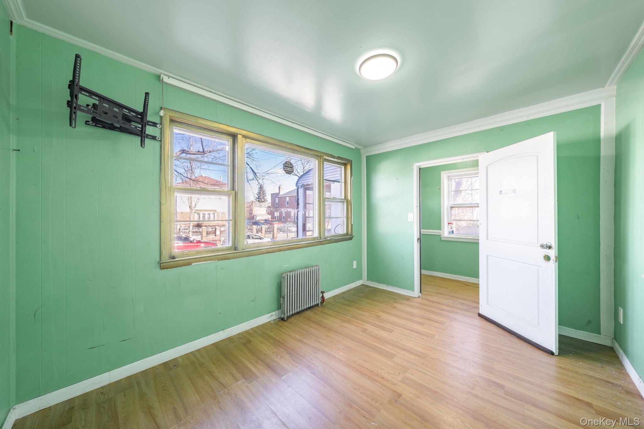 2214 Hermany Avenue Bronx, NY 10473 - Photo 22 of 43 a view of room with window and hardwood