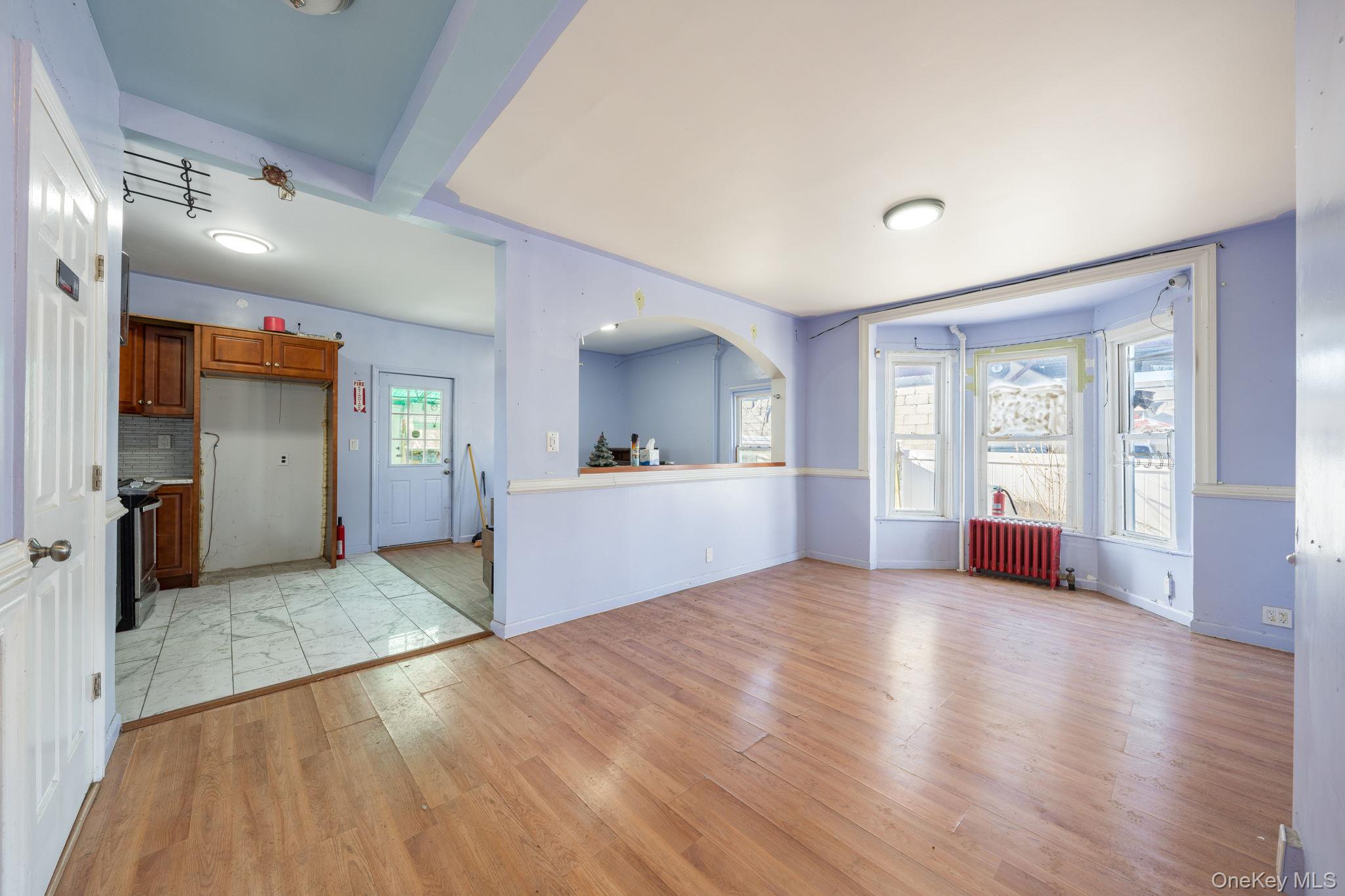 2214 Hermany Avenue Bronx, NY 10473 - Photo 24 of 43 a view of a big room with wooden floor and windows