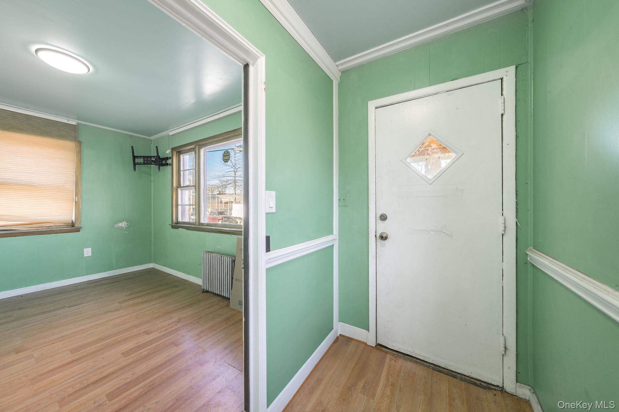 2214 Hermany Avenue Bronx, NY 10473 - Photo 27 of 43 wooden floor in an empty room with a window