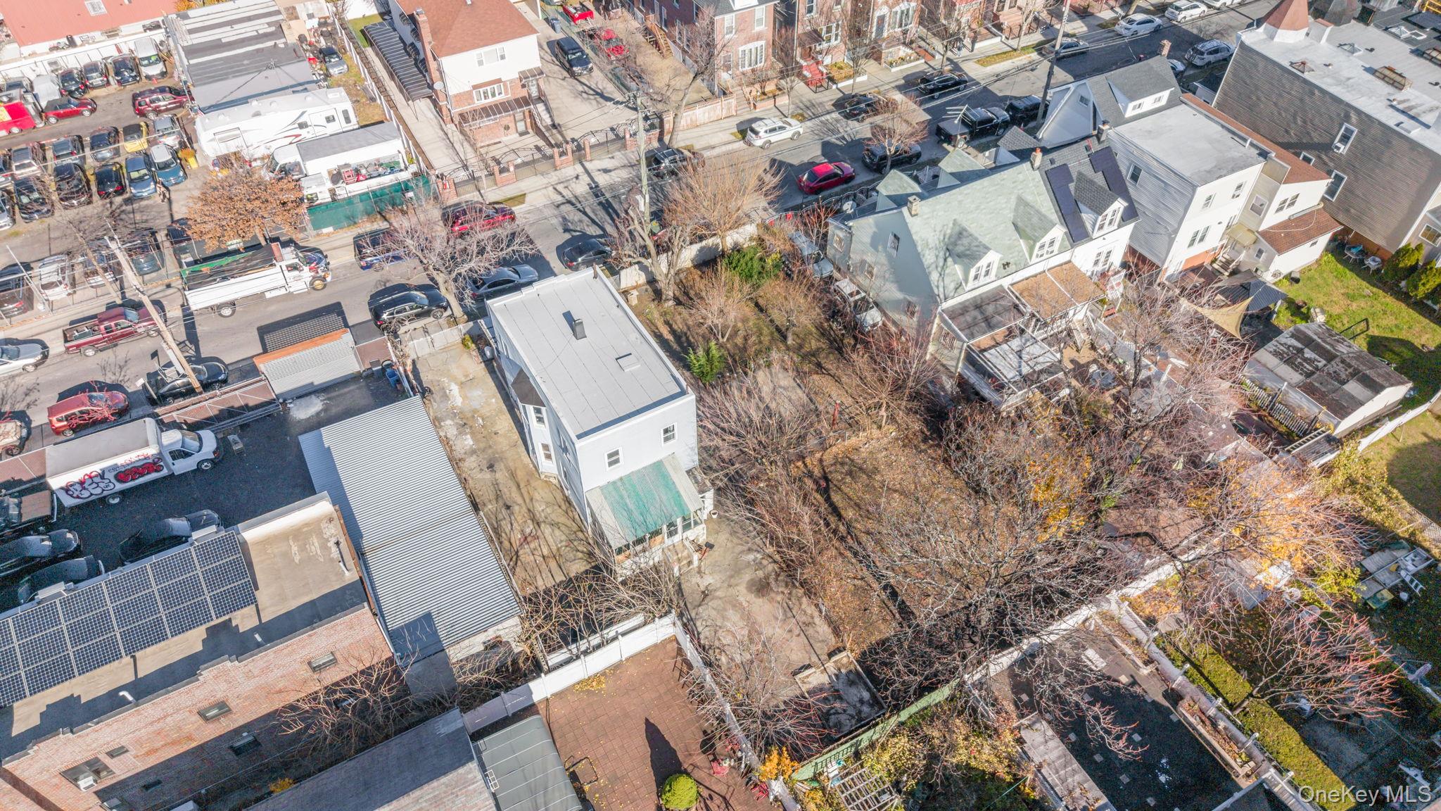 2214 Hermany Avenue Bronx, NY 10473 - Photo 30 of 43 a aerial view of a house with a yard