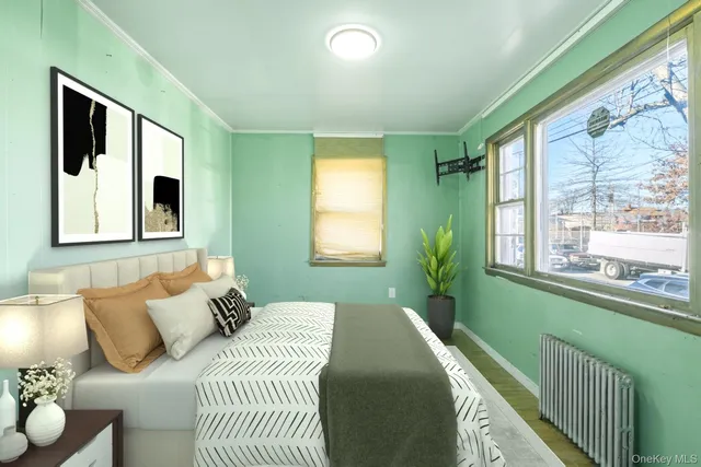 a bedroom with a large bed and a large window