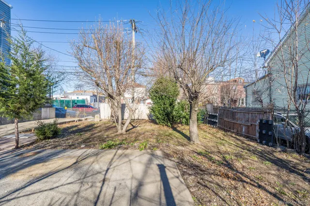a view of a backyard of the house