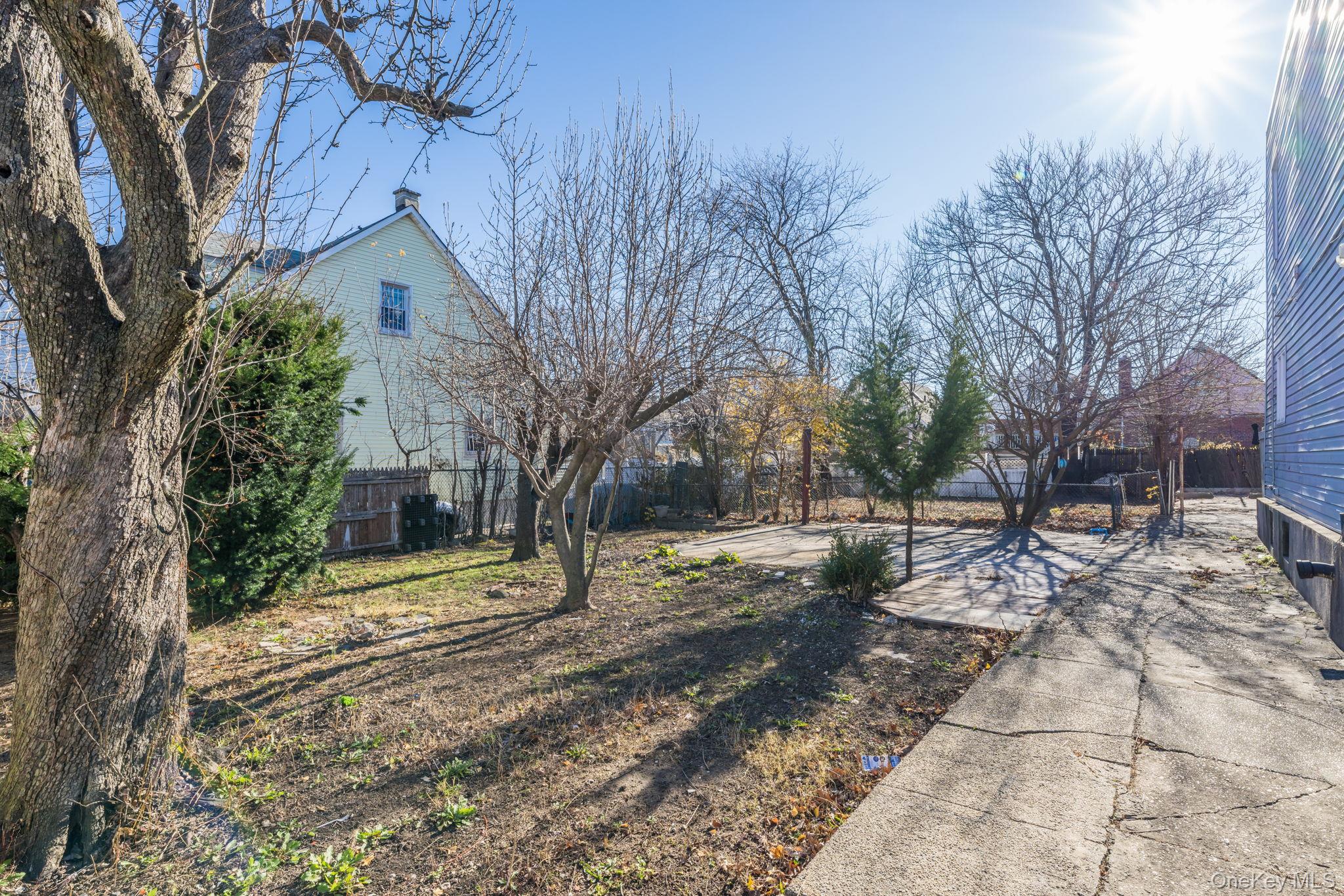2214 Hermany Avenue Bronx, NY 10473 - Photo 33 of 43 a view of a yard with trees