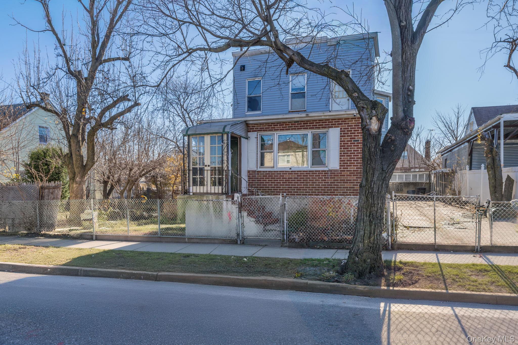 2214 Hermany Avenue Bronx, NY 10473 - Photo 35 of 43 a view of a house with a yard