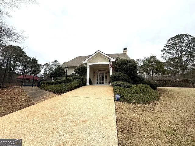a view of a house with a snow on the road