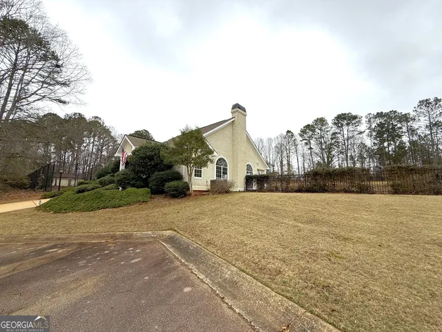a view of a swimming pool with an outdoor space and seating area