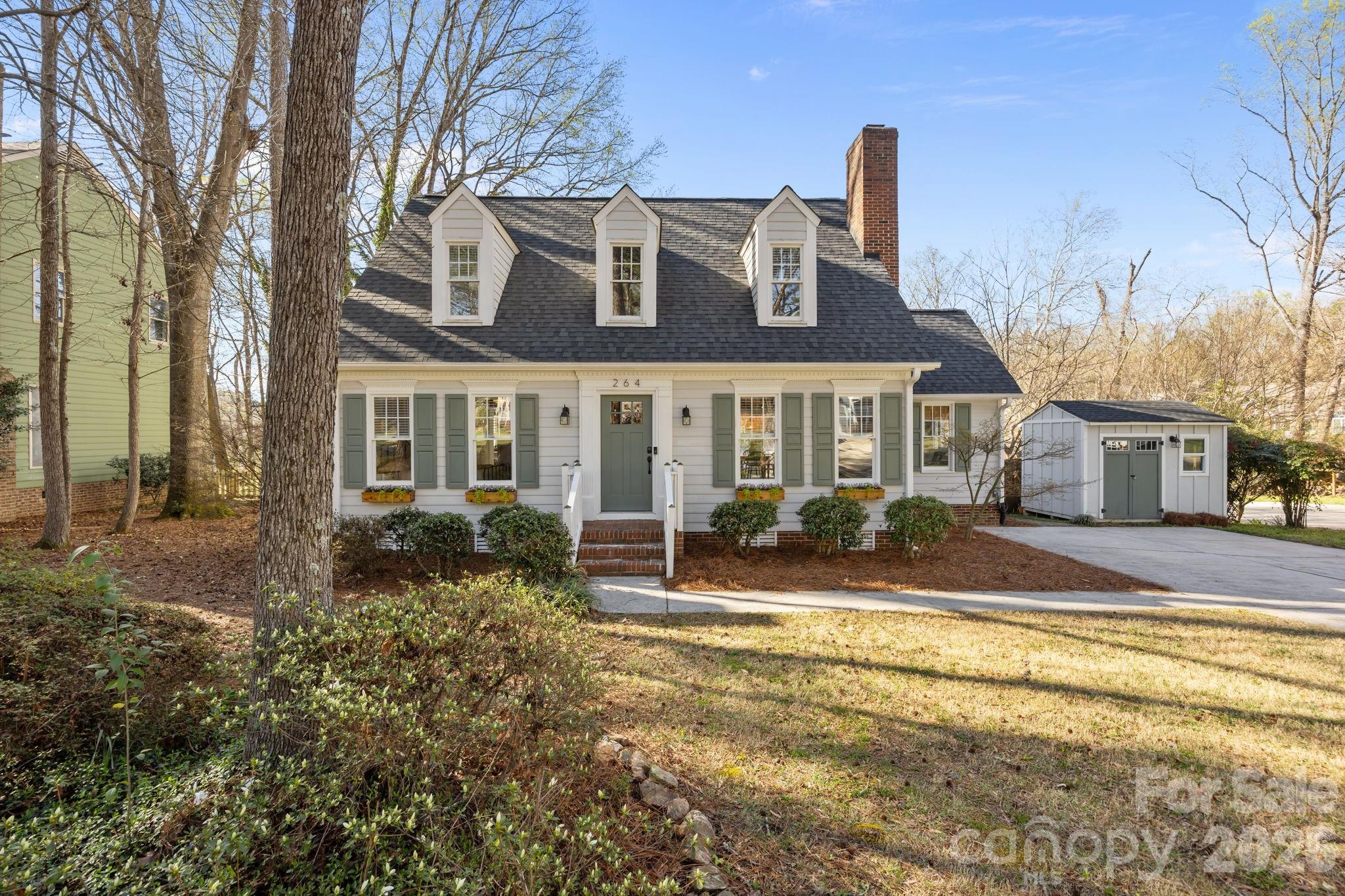 264 Post Oak Avenue Southwest Concord, NC 28025 - Photo 1 of 39 a view of a house with a yard and sitting area