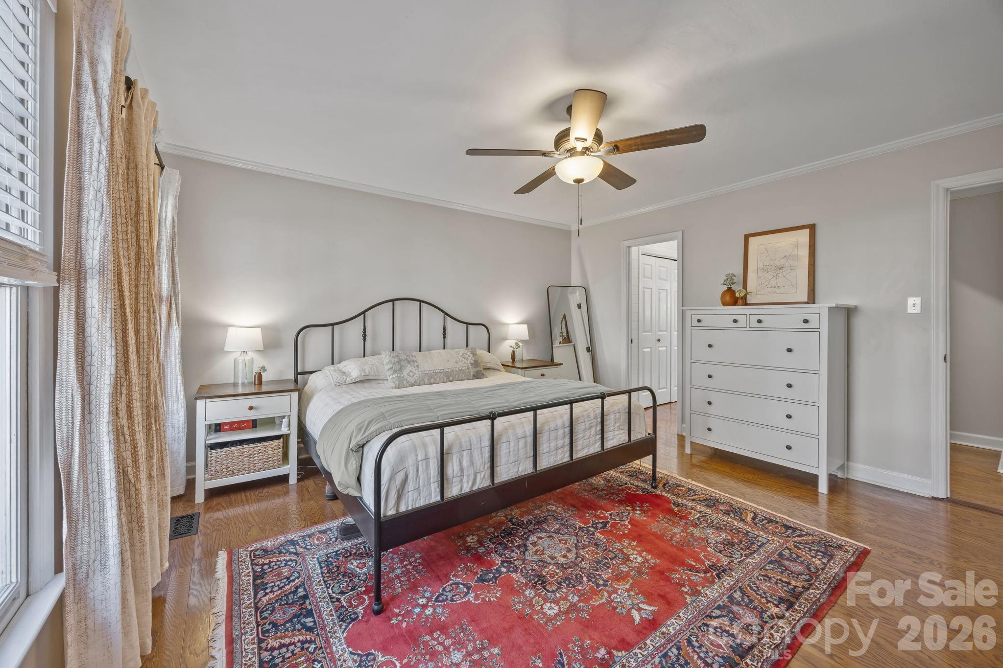 264 Post Oak Avenue Southwest Concord, NC 28025 - Photo 19 of 39 a bedroom with a bed and a chandelier