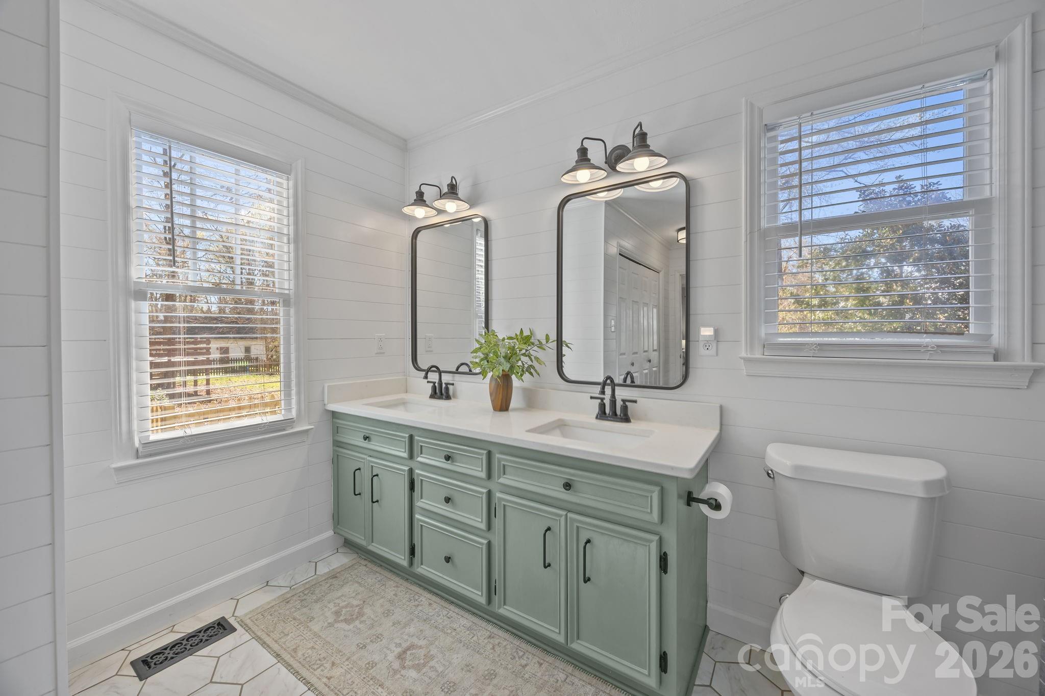 264 Post Oak Avenue Southwest Concord, NC 28025 - Photo 20 of 39 a bathroom with 2 sink toilet and a mirror