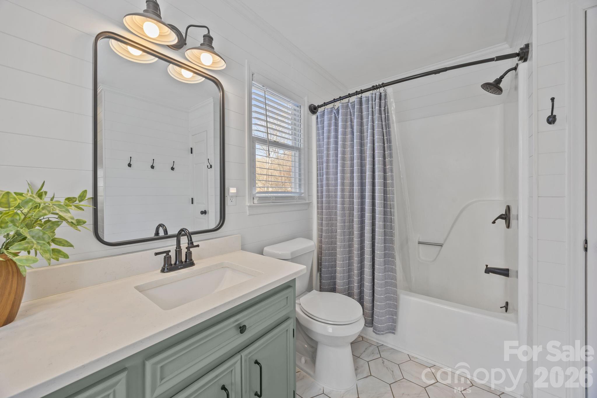 264 Post Oak Avenue Southwest Concord, NC 28025 - Photo 21 of 39 a bathroom with a sink a toilet and shower
