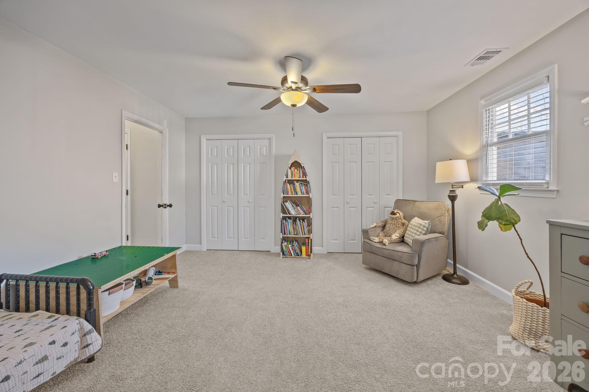 264 Post Oak Avenue Southwest Concord, NC 28025 - Photo 25 of 39 a living room with furniture and a chandelier