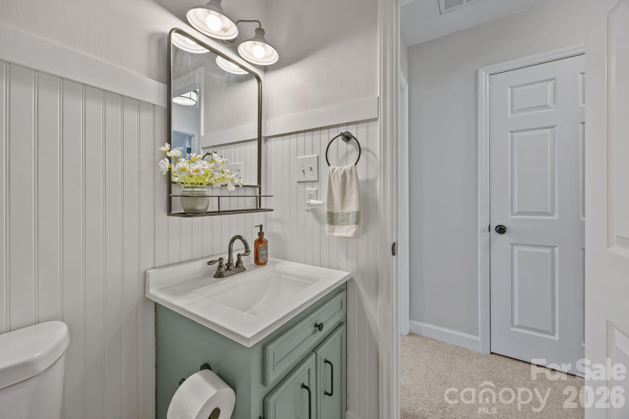 264 Post Oak Avenue Southwest Concord, NC 28025 - Photo 29 of 39 a bathroom with a sink and a mirror