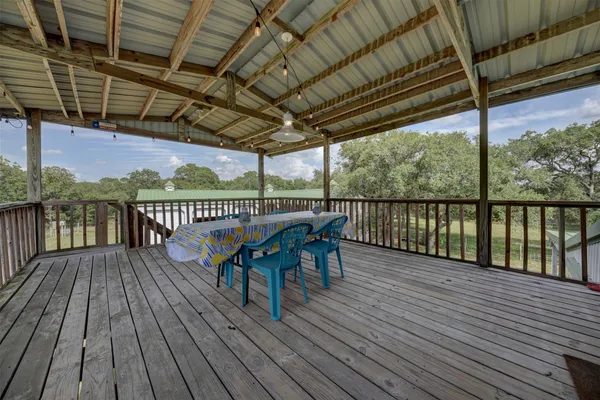 a living room with furniture a wooden floor and a chandelier