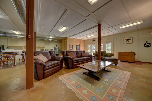 a room with pool table and a table