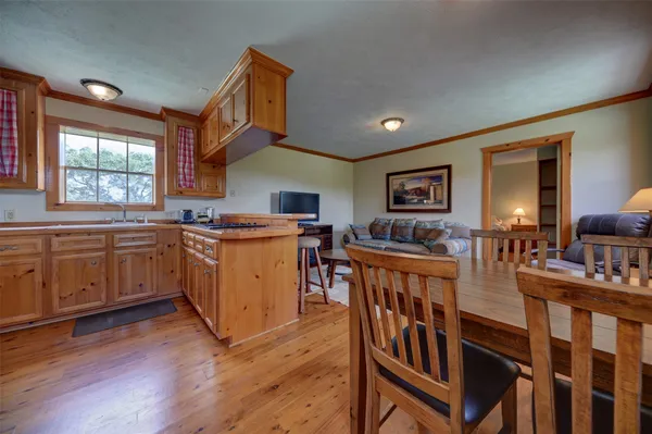 a kitchen with stainless steel appliances granite countertop a sink and cabinets