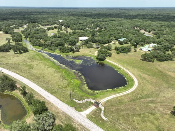 a view of grassy field with trees