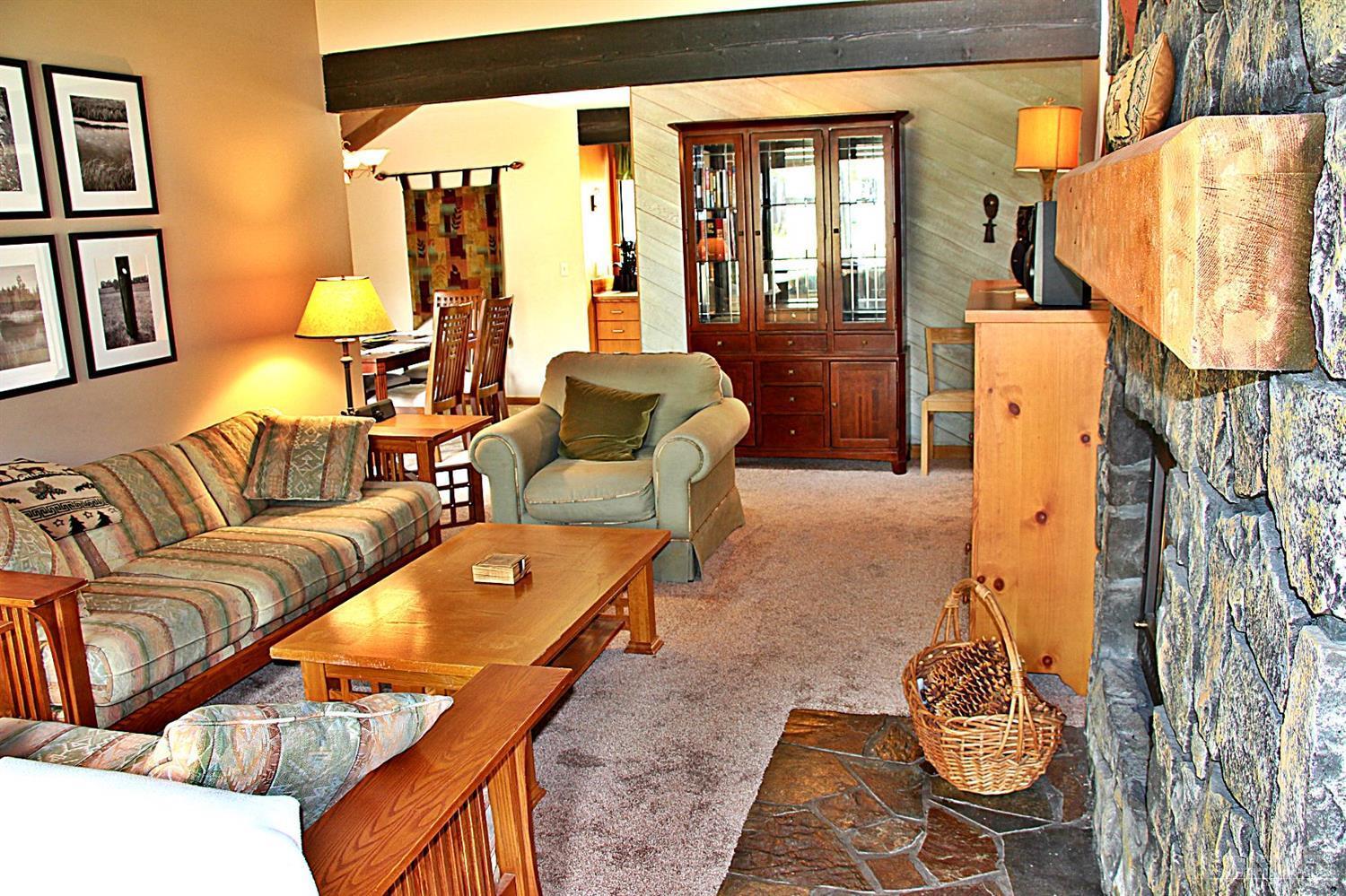 4 Meadow House Loop Sunriver, OR 97707 - Photo 4 of 17 a living room with furniture and a floor to ceiling window