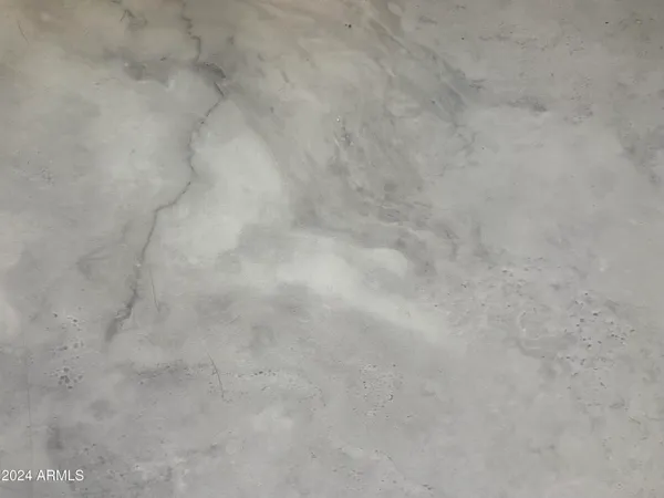 a view of a porch with furniture and a yard