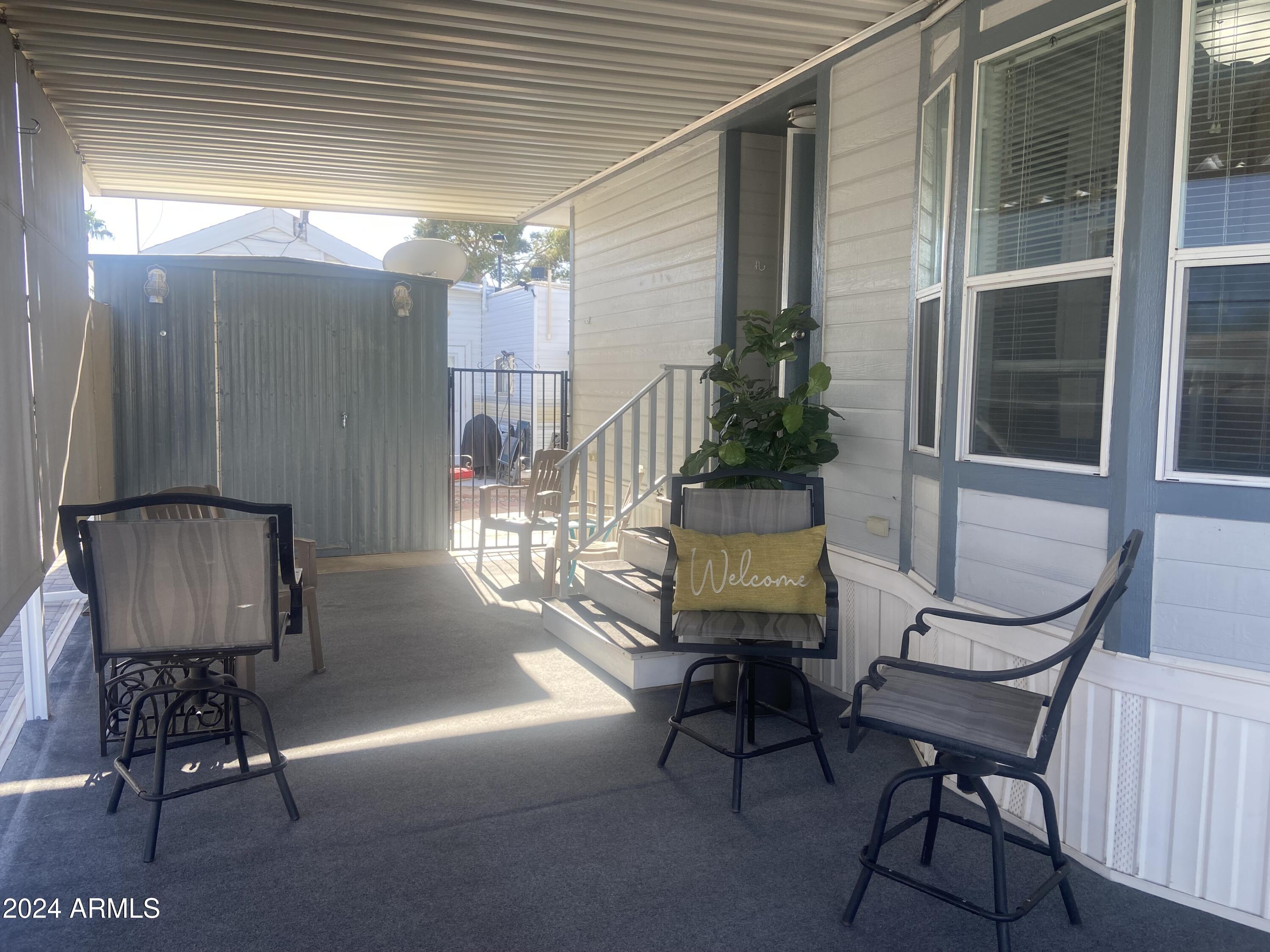2205 West Klamath Avenue Apache Junction, AZ 85119 - Photo 26 of 36 a view of a porch with furniture