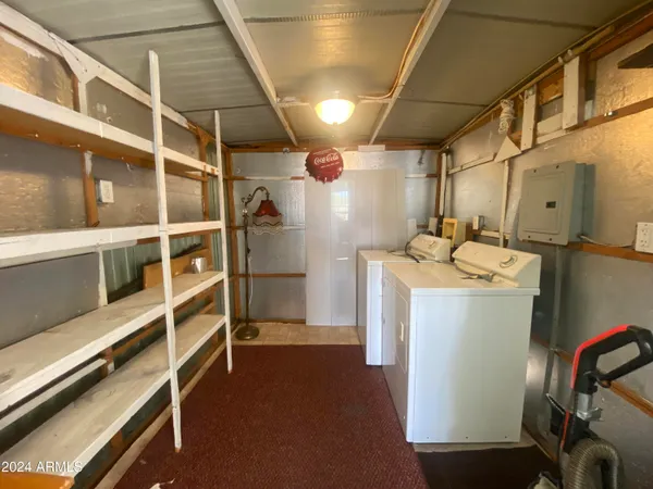 a view of a livingroom with furniture and a fireplace