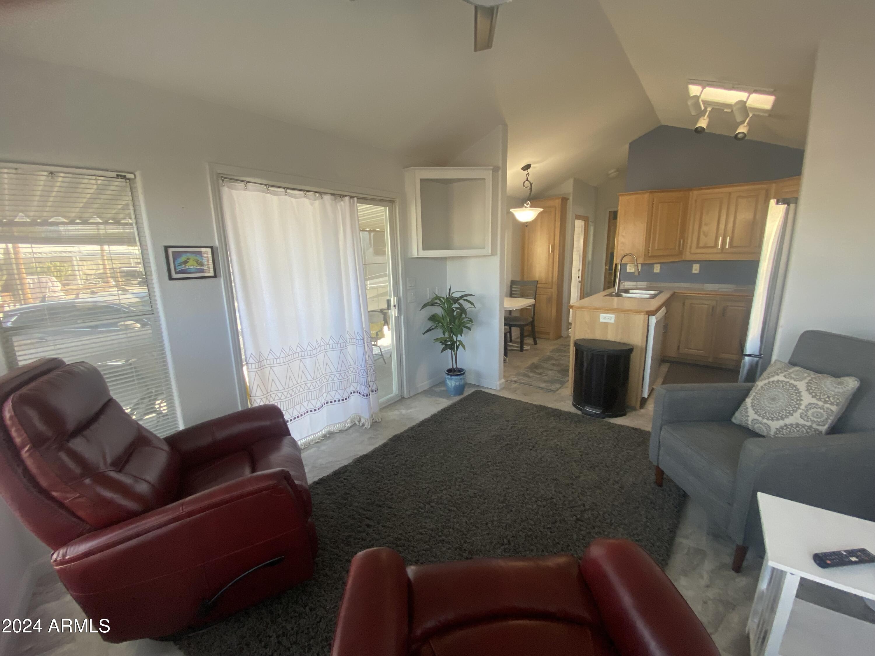 2205 West Klamath Avenue Apache Junction, AZ 85119 - Photo 6 of 36 a living room with furniture fireplace and a window