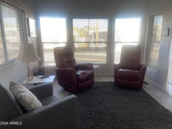 a living room with furniture and a window