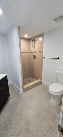 a bathroom with a sink a mirror and shower