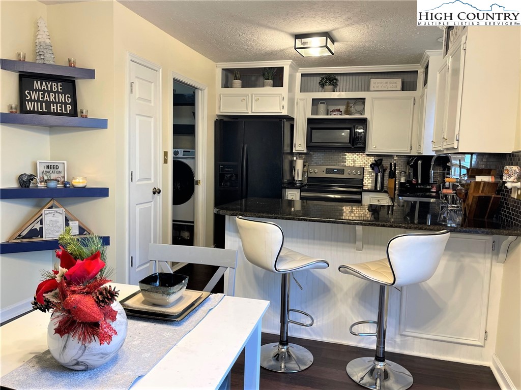 3490 Section House Road Hickory, NC 28601 - Photo 13 of 39 a kitchen with stainless steel appliances granite countertop a refrigerator dining table and chairs
