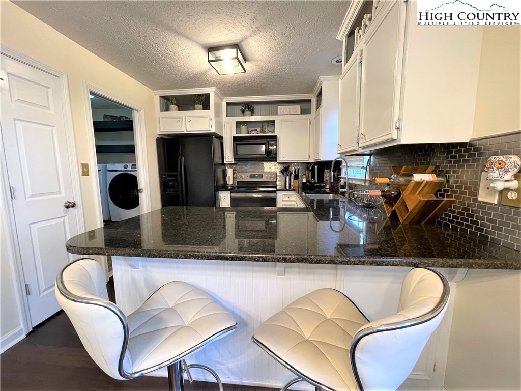 3490 Section House Road Hickory, NC 28601 - Photo 14 of 39 a kitchen with stainless steel appliances granite countertop a granite counter tops and a refrigerator