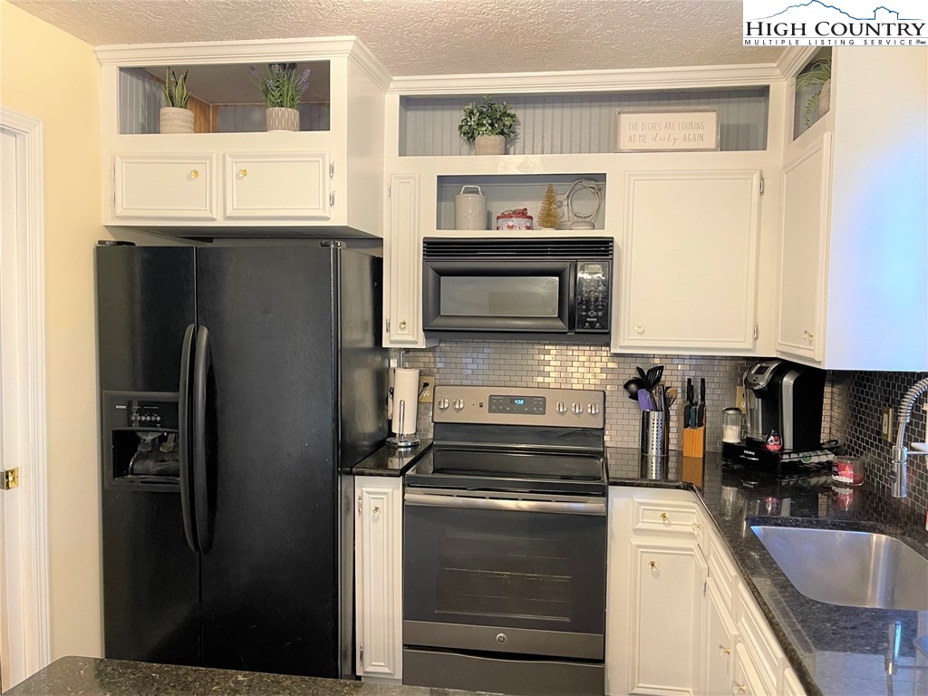 3490 Section House Road Hickory, NC 28601 - Photo 16 of 39 a kitchen with stainless steel appliances granite countertop a refrigerator and a sink