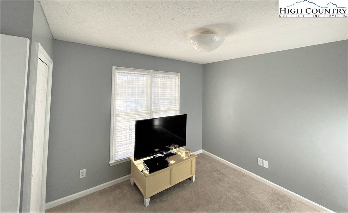 3490 Section House Road Hickory, NC 28601 - Photo 24 of 39 a living room with furniture and a flat screen tv