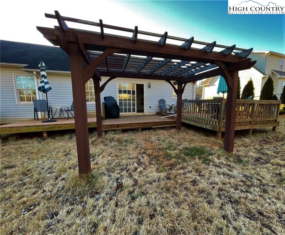 3490 Section House Road Hickory, NC 28601 - Photo 34 of 39 a view of a blue house with a small yard and a wooden deck