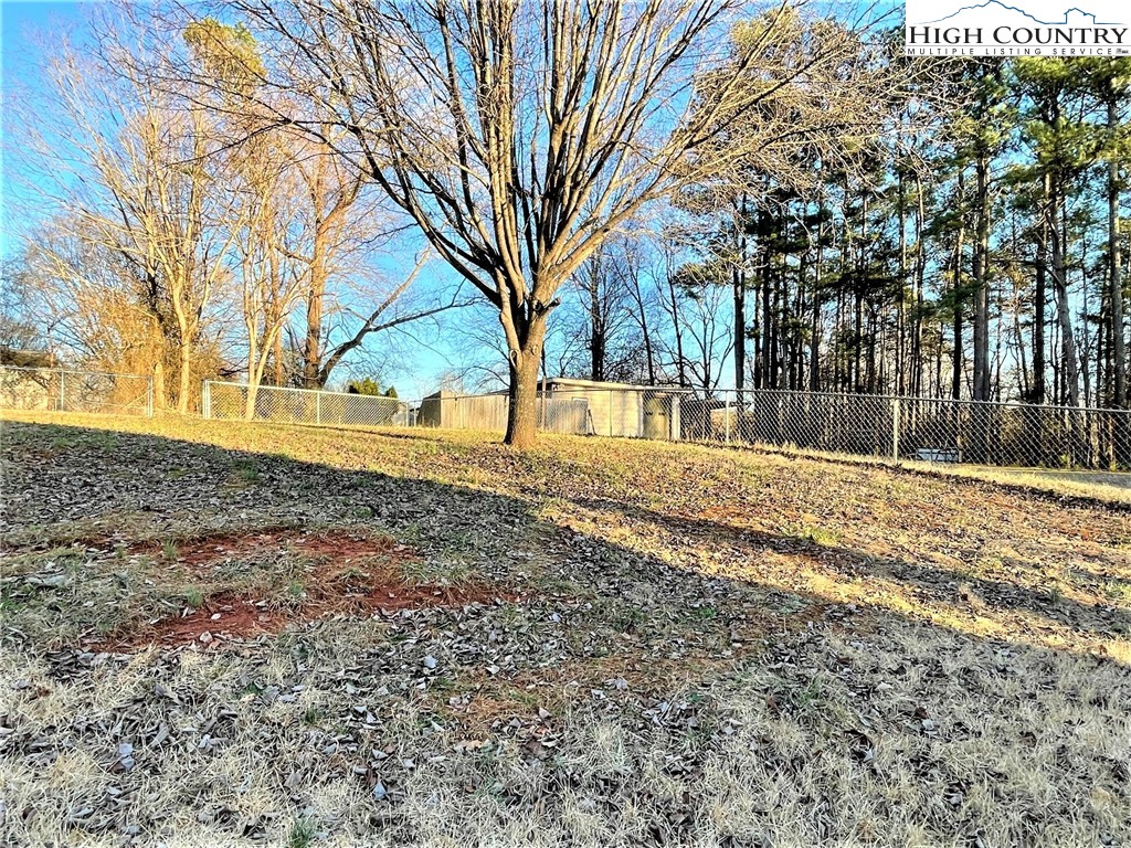 3490 Section House Road Hickory, NC 28601 - Photo 36 of 39 a backyard of a house with large trees